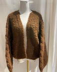 Brown knitted cardigan on a white mannequin with a white background