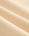 Close-up of beige fabric with a ribbed texture