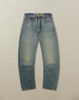 Pair of blue jeans on a beige background