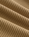 Close-up of beige ribbed fabric texture