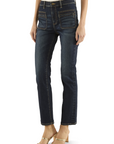 Person wearing dark blue jeans on a white background
