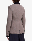 Brown blazer worn by a person on a white background