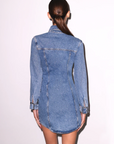 Denim shirt dress worn by a model on a white background
