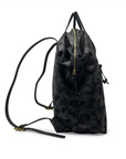 Black drawstring bag with a gold zipper on a white background
