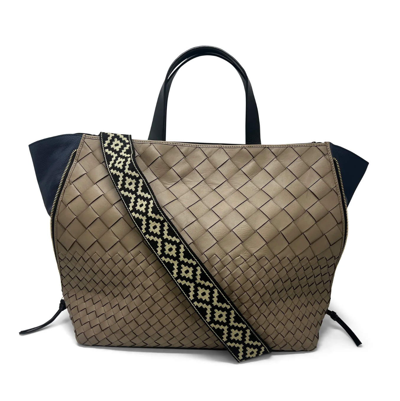 Brown woven handbag with a patterned strap on a white background