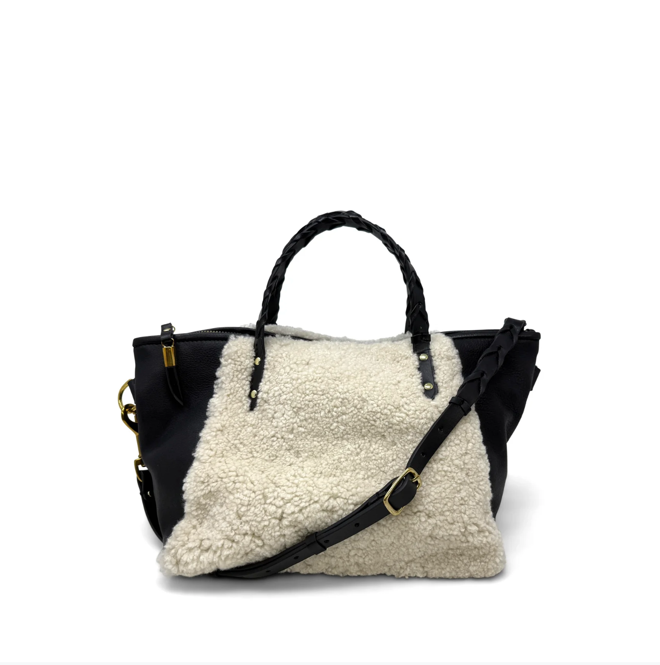 Black handbag with a white shearling liner on a white background