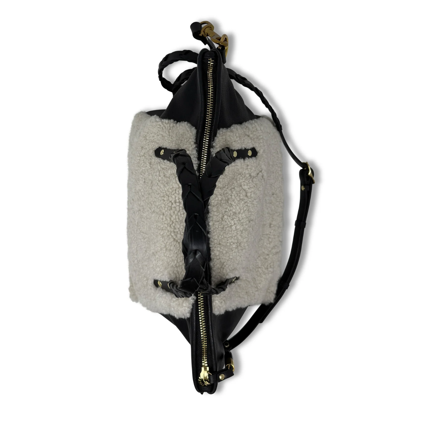 Backpack with gray shearling-like exterior and black leather accents on a white background