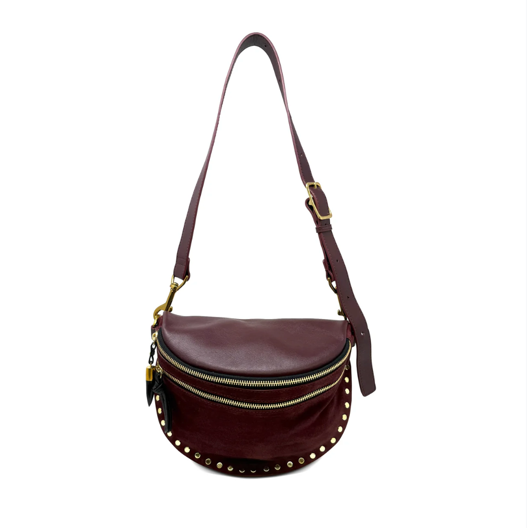 Brown leather bag with gold accents on a white background