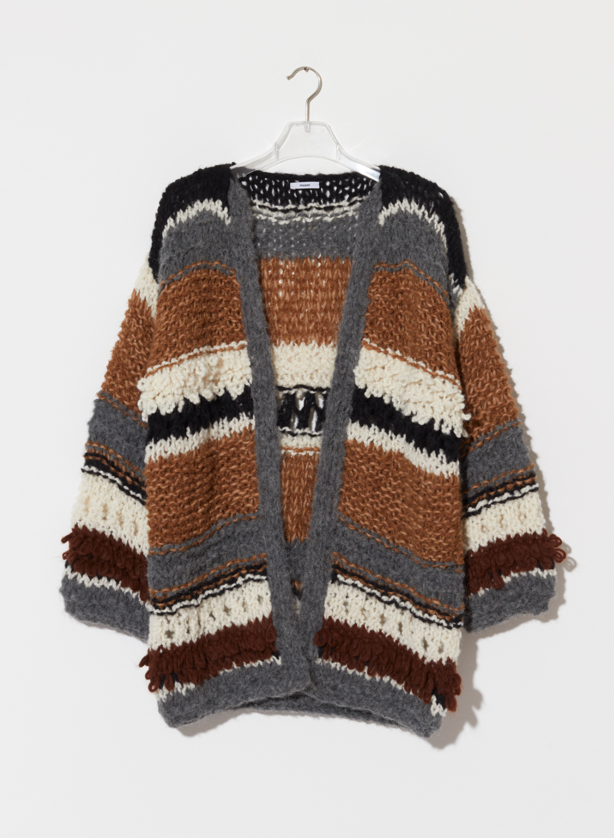 Striped cardigan hanging on a white background