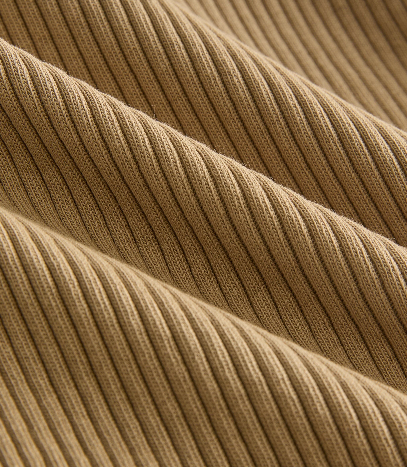 Close-up of beige ribbed fabric texture