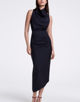 Woman wearing a black sleeveless dress on a white background