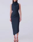 Woman wearing a navy blue dress on a white background
