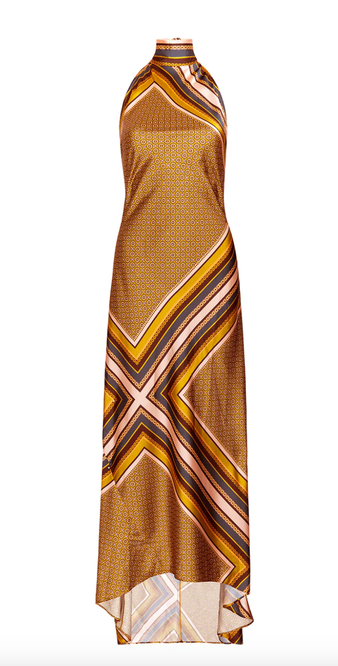 Gold patterned halter neck dress on a white background