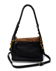 Black leather handbag with brown shearling interior on a white background