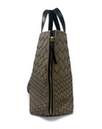 Brown woven backpack with a gold zipper on a white background