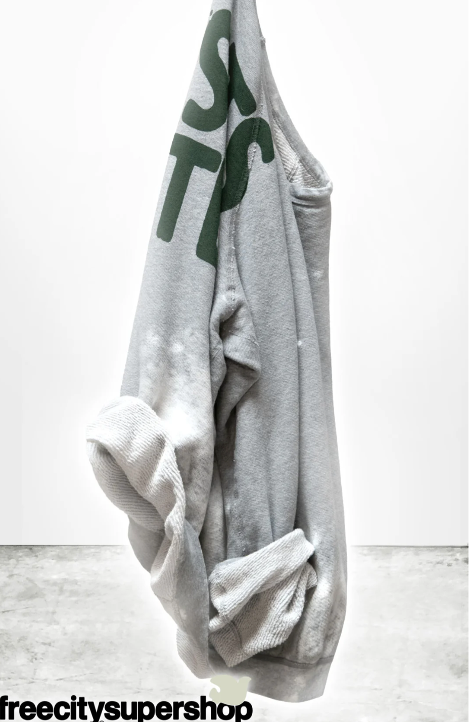 Gray sweatshirt with green text on a white background