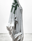 Gray sweatshirt with green text on a white background