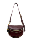 Brown leather bag with gold accents on a white background