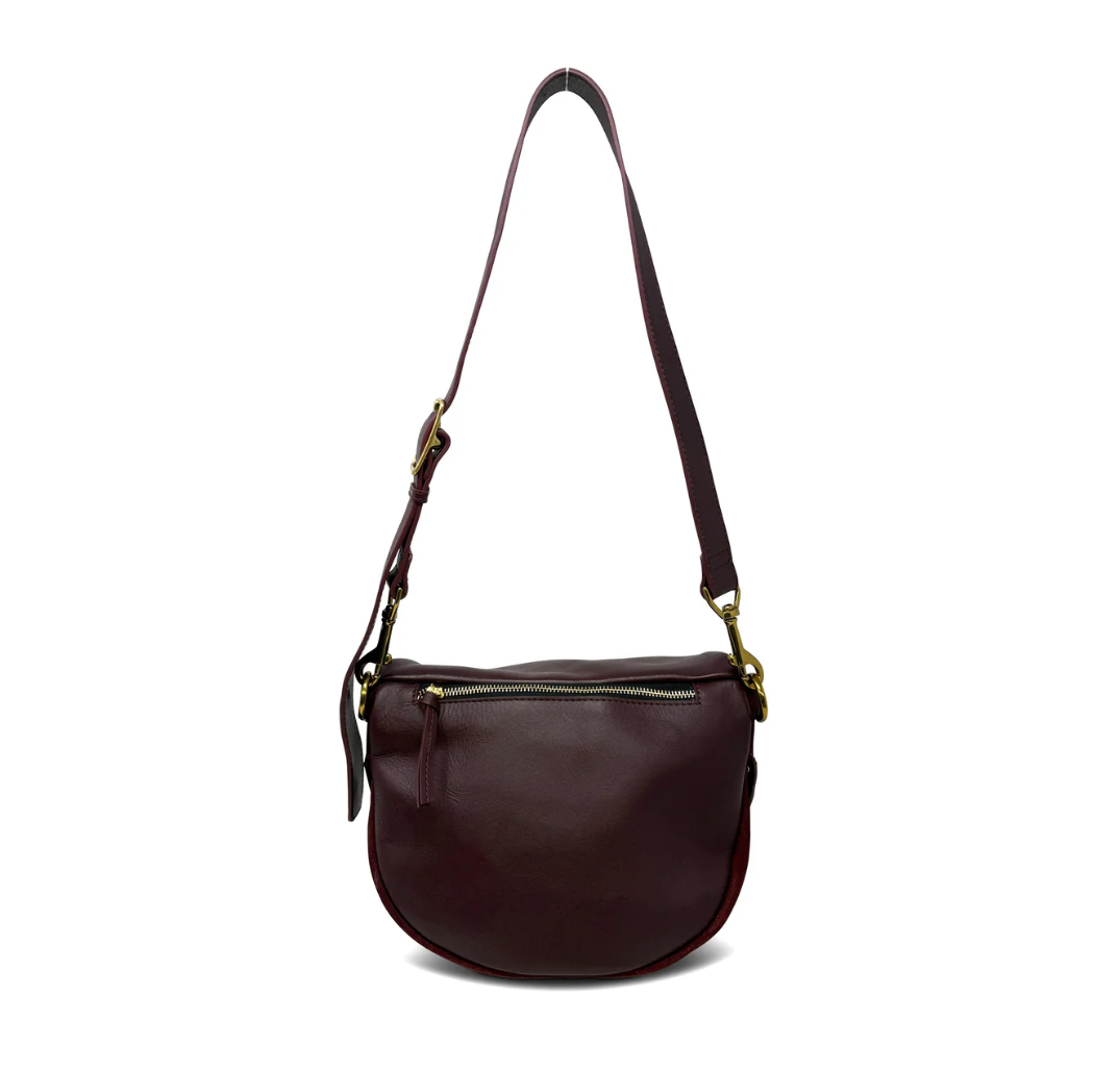 Brown leather handbag with a strap on a white background